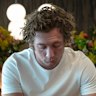 Jeremy Allen White as Carmy Berzatto in The Bear. Season three ends with a preview of the review from the Chicago Tribune of Carmy’s new restaurant venture. 