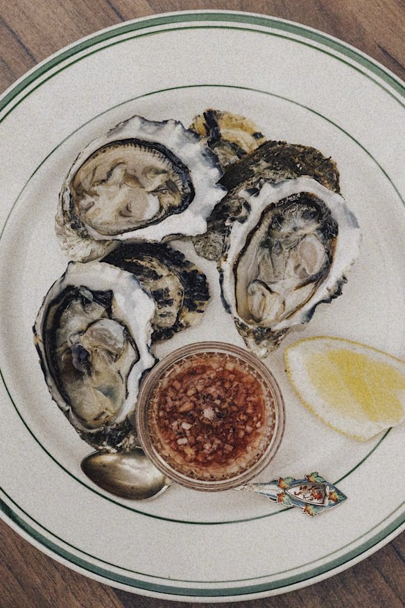 Oysters with mignonette and lemon.