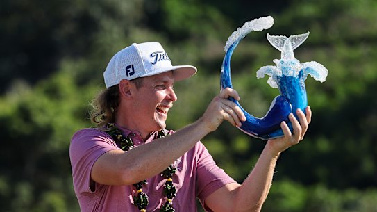 Cameron Smith of Australia celebrates with the Tournament of Champions trophy.
