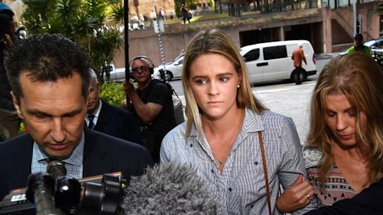 Australian swimmer Shayna Jack (centre) is seen arriving for a briefing with ASADA in Brisbane on Friday.