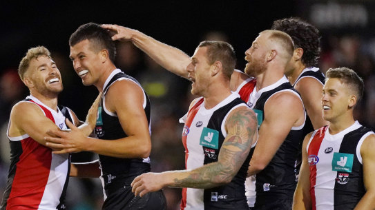 On the up: Rising ruck star Rowan Marshall (second left) celebrates a goal with teammates during St Kilda's win over Hawthorn in the AFL Marsh Community Series at RSEA Park in Moorabbin.