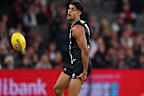 Nasiah Wanganeen-Milera grabs his hamstring. 