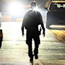 A police officer walks down the Campbelltown street on Monday night.