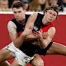 Carlton’s Blake Acres tackles Bomber  Xavier Duursma in their round 13 clash.