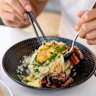 Sana’s udon carbonara comes with charred kaiserfleisch, smoked dashi, a soft egg and heaps of black pepper. 