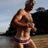 Former prime minister Tony Abbott wears his budgie smugglers for a charity ocean swim in 2010.  