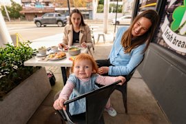 Ruby Davies-Nelson with daughter Bonnie and friend Susannah McCaughan at Cafe Jack’s in Kensington. Both mothers manage screen time with other activities when dining out.