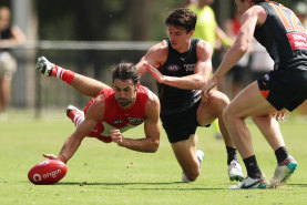 Brodie Grundy and Sam Taylor compete for the ball in a pre-season clash.
