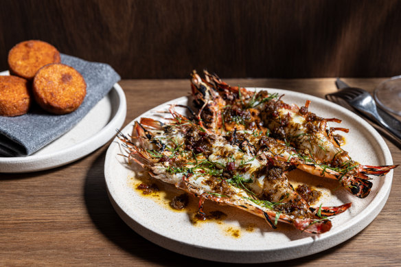 Go-to dish: Tiger prawns, jungle curry, brown butter, pictured with a side of idli (steamed rice and lentil cakes).