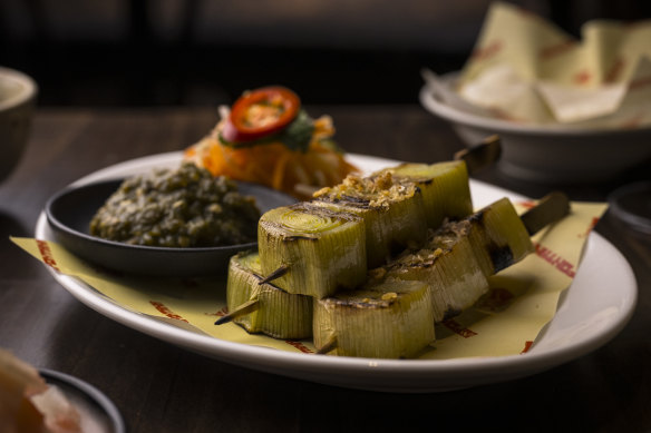 Leek skewers come with burnt green chilli.