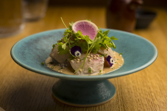 Kingfish sashimi with goma sauce.