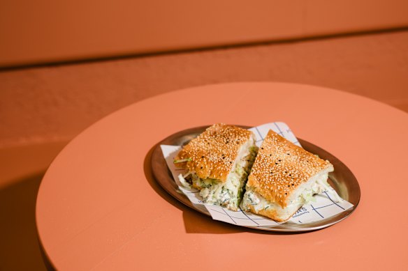 Poached chicken schiacciata with avocado, cabbage, apple, pickles and salsa verde.