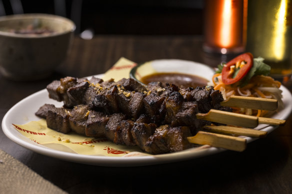 Crisp garlic adds texture and flavour to tender ox tongue skewers.