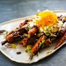 Roasted carrots with a hunk of fresh honeycomb.