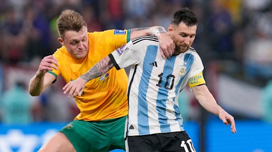 Harry Souttar tangles with Lionel Messi during the Socceroos’ round-of-16 loss to eventual champions Argentina in Qatar.