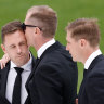 Joel (left), Adam and Scott Selwood farewell their brother, Troy, at GMHBA stadium.