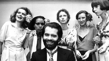 Karl Lagerfeld poses with models in Germany in 1973.