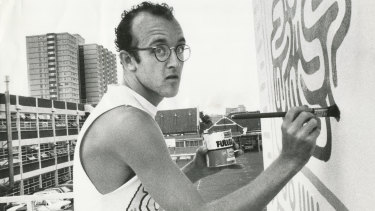 New York graffiti artist Keith Haring painting his mural on the wall of the Collingwood Technical School in Johnston Street in 1984.