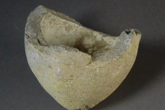 The shard of thick, heavy pottery which Professor Matheson believes was an ancient hand grenade.