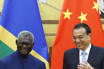 Solomon Islands Prime Minister Manasseh Sogavare with Chinese Premier Li Keqiang in Beijing in October 2019.
