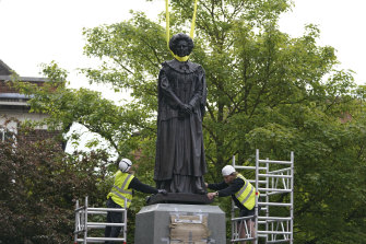 A statue of Baroness Margaret Thatcher is lowered into place in her home town of Grantham, England.