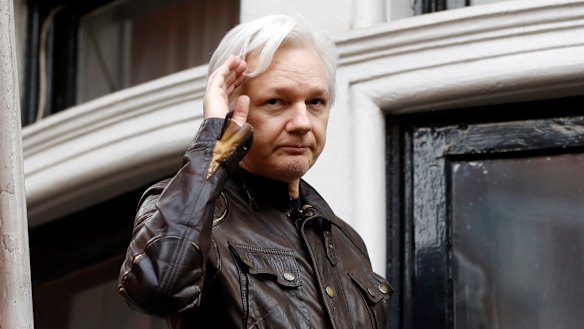 WikiLeaks founder Julian Assange greets supporters from a balcony of the Ecuadorian embassy in London in June, 2017.