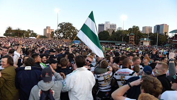 History: Warringah supporters swarm North Sydney Oval after club's first Shute Shield win in 12 years. 