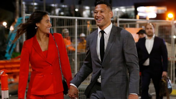 $3.6 million smile: Folau leaves last week's hearing with wife Maria after agreeing a deal with Rugby Australia.