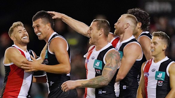 On the up: Rising ruck star Rowan Marshall (second left) celebrates a goal with teammates during St Kilda's win over Hawthorn in the AFL Marsh Community Series at RSEA Park in Moorabbin.