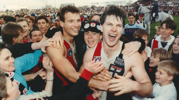 Danny Frawley (right) with Stewart Loewe after beating Fitzroy by one point at Moorabbin in 1990.