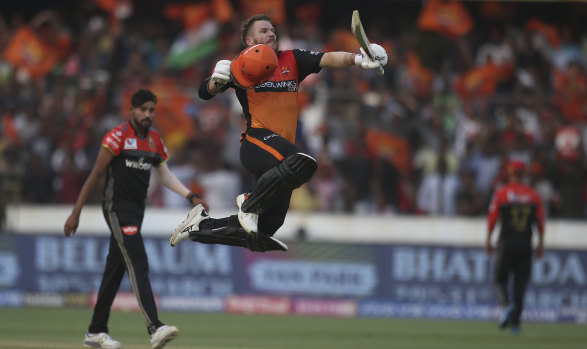 Walking on air: David Warner celebrates scoring a century for Sunrisers Hyderabad  against Royal Challengers Bangalore in the IPL on Sunday.