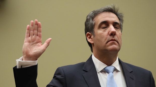 Michael Cohen, former personal lawyer to US President Donald Trump, is sworn in during the House Oversight Committee hearing. 