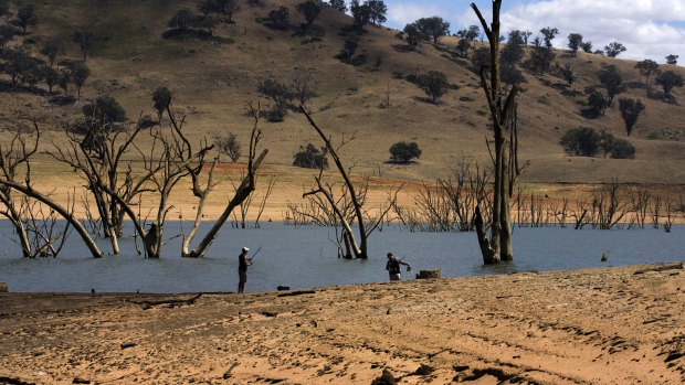 A couple of fishermen on the enlarging banks of Lake Hume, near Albury, where water levels are low due to drought.  