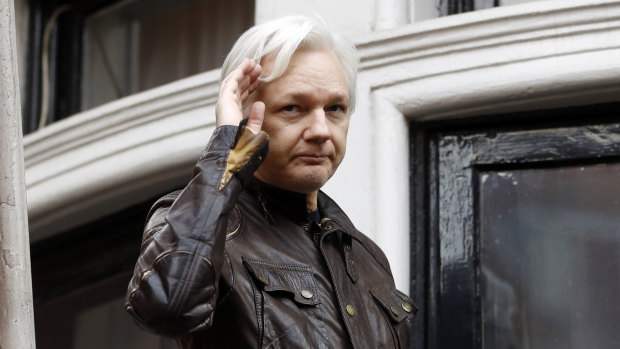 WikiLeaks founder Julian Assange greets supporters from a balcony of the Ecuadorian embassy in London in June, 2017.