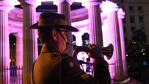 Bugler CPL Aaron Madden is seen during Anzac Day commemorations in Brisbane, Wednesday, April 25, 2018.