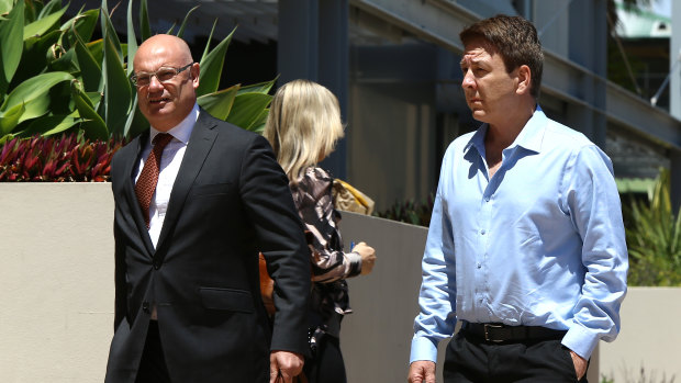 Dreamworld Head of Engineering Chris Deaves (right) arrives at the inquest into the Dreamworld disaster at Southport.