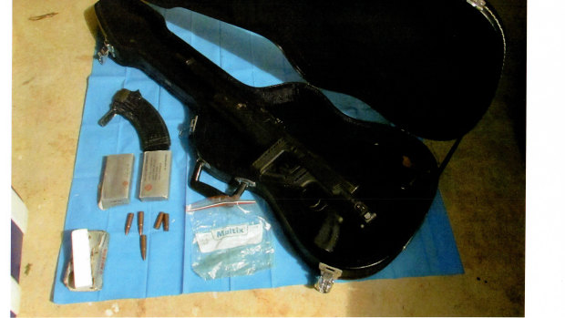 The assault rifle and the guitar case used to hide it.