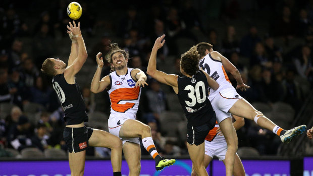 Wild about Harry: Young Blue Harry McKay marks at the back of the pack under pressure during Carlton's loss to GWS.