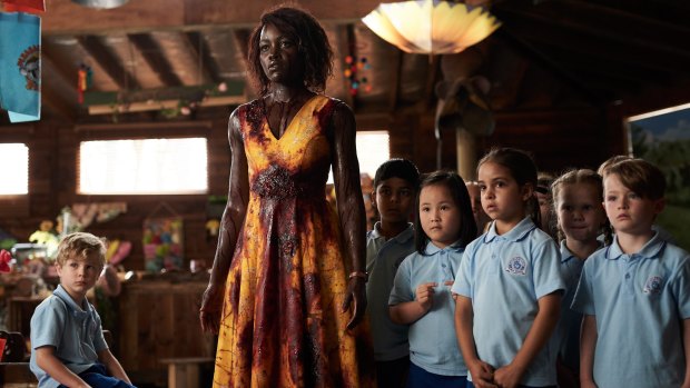 "I love being asked to get out of my comfort zone": Lupita Nyong'o as Miss Caroline with her kindergarten class in Little Monsters.