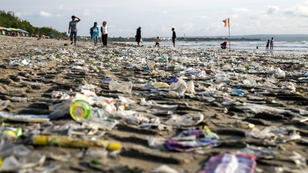Plastic waste brought in by strong waves on Bali's Kuta beach. Chemical companies are facing a backlash over the plastic they produce.