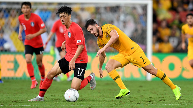 Dispossessed: Mathew Leckie chases Lee Chungyong.