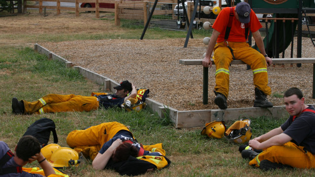 Firefighters take a break at Arthur's Creek.