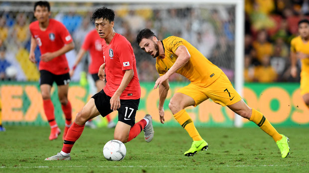Dispossessed: Mathew Leckie chases Lee Chungyong.