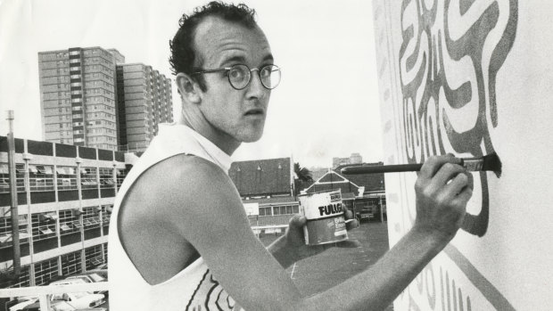 New York graffiti artist Keith Haring painting his mural on the wall of the Collingwood Technical School in Johnston Street in 1984.