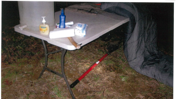 Mr Woodford's tomahawk and shovel at the couple's camp table.
