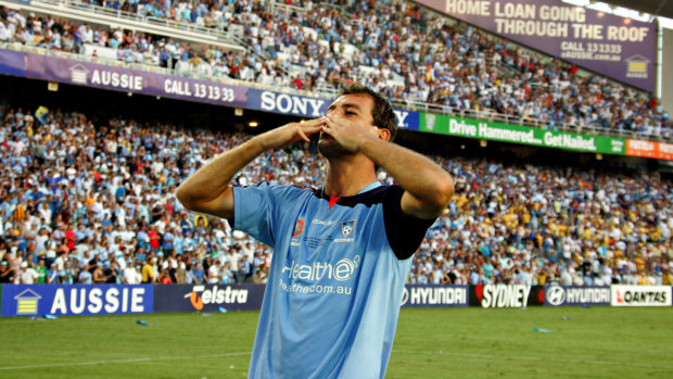 Fan favourite: Rudan salutes The Cove after Sydney FC's victory in the inaugural A-League grand final in 2006.