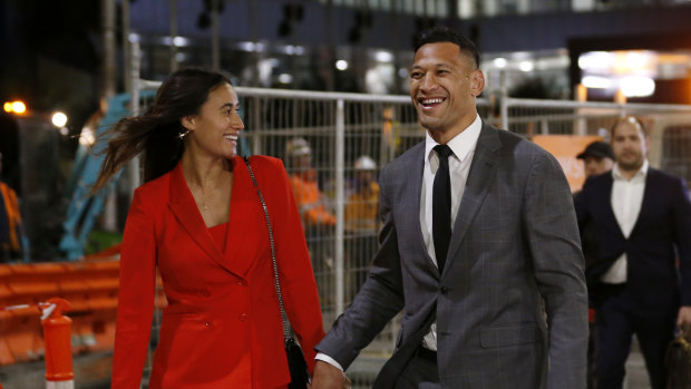 Israel Folau leaves a hearing with wife Maria after agreeing to a deal with Rugby Australia.