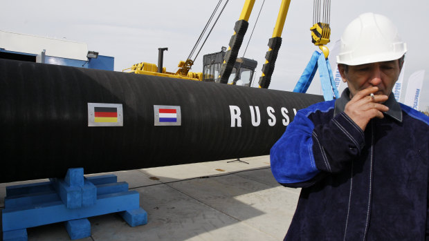 A Russian construction worker smokes in Portovaya Bay some 170 kms north-west from St. Petersburg, Russia, during a ceremony marking the start of Nord Stream pipeline construction in 2010.