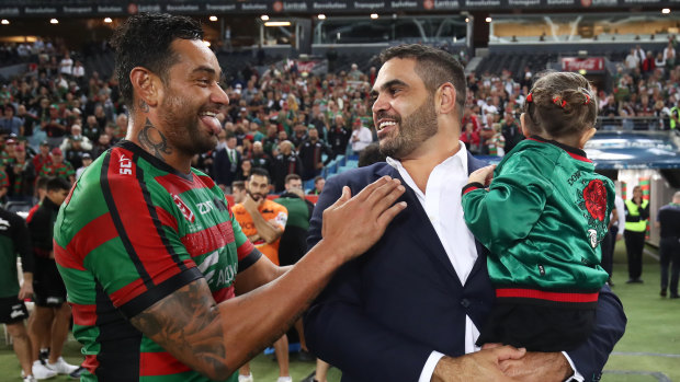 Old boys' club: John Sutton and Greg inglis share a joke after the defeat of the Broncos, however, Sutton's rendition of the 'goanna' didn't go down quite as well as when Inglis performed the try celebration.