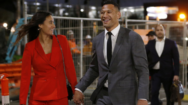 $3.6 million smile: Folau leaves last week's hearing with wife Maria after agreeing a deal with Rugby Australia.